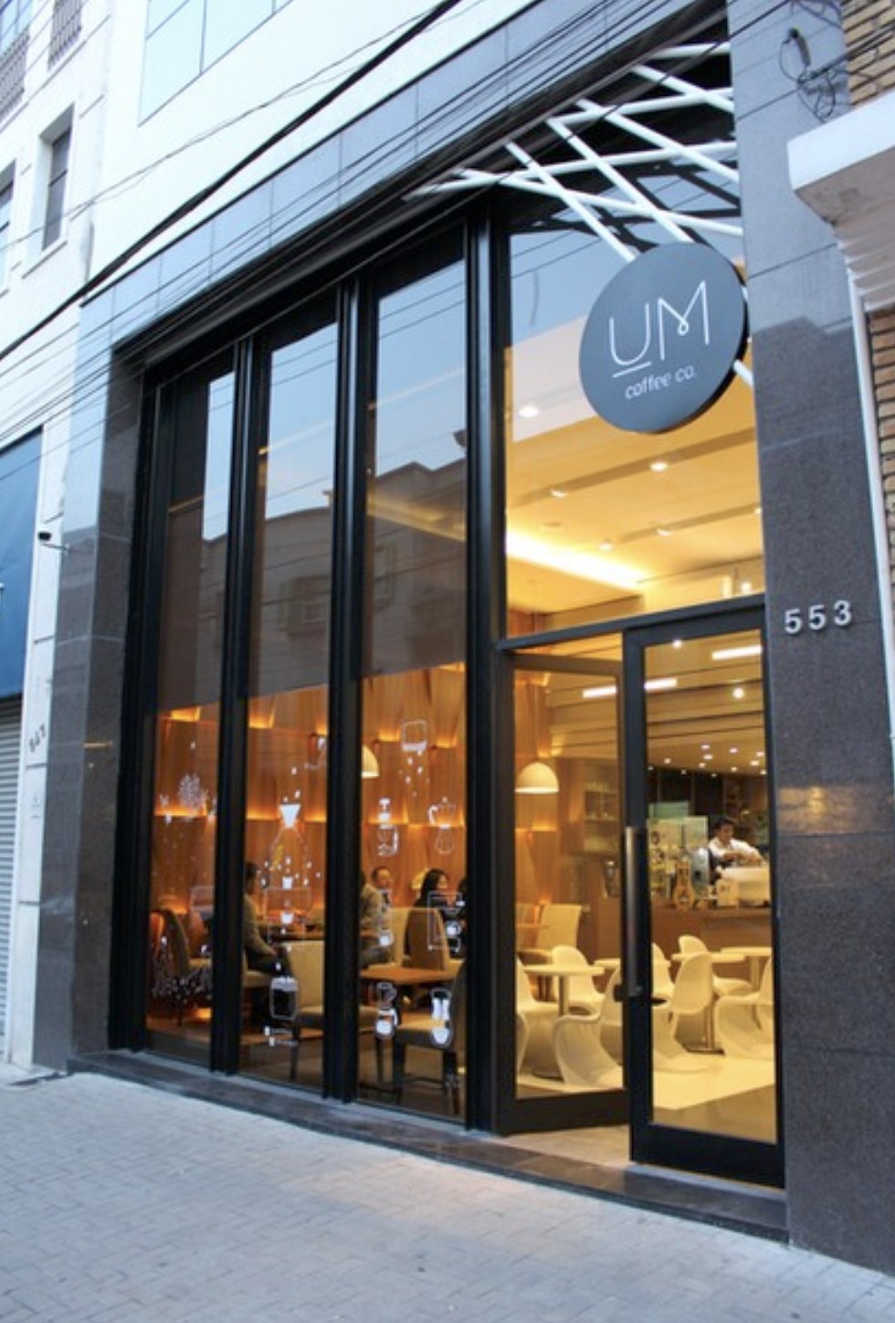 The storefront and street facing seating at Um Coffee Co.
